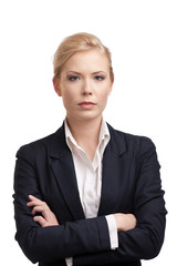 Wall Mural - Business woman in a black suit, looking at the camera