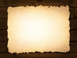 burnt paper at wooden background
