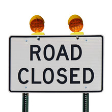 Road Closed Sign Against A White Background