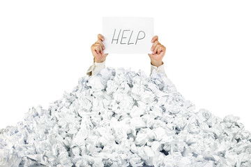 Person under crumpled pile of papers with a help sign / isolated