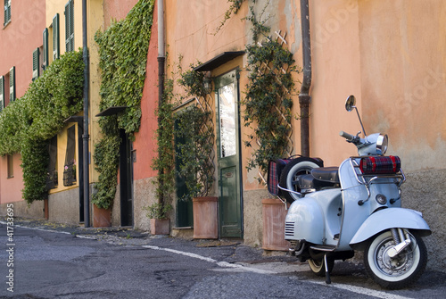 Obraz w ramie Vintage scooter parked in the street