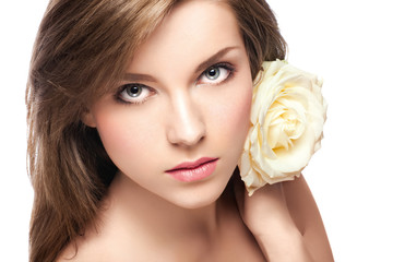 young beautiful girl with perfect skin  and a rose