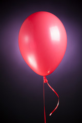 Wall Mural - festive red balloon on purple background