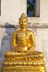 Wall Mural - gold buddha on side of thai church