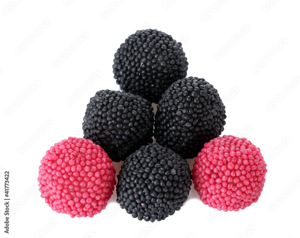 red and black candy berries isolated on white