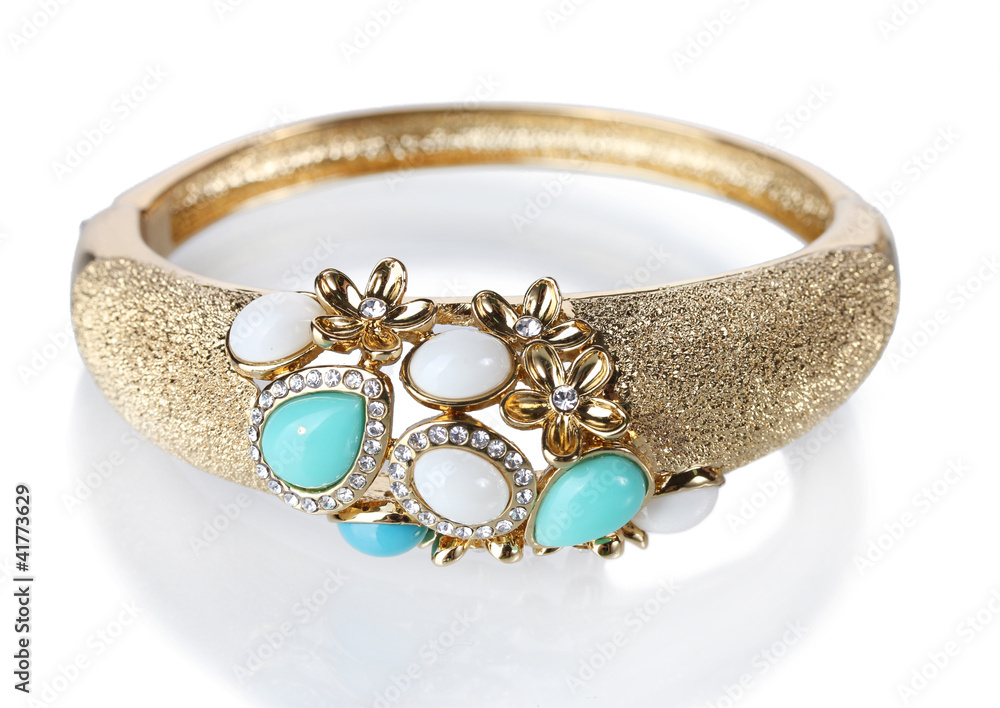 Beautiful golden bracelet with precious stones isolated on