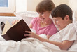 © glenkar - Children read book in bed