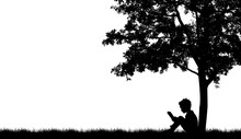 Silhouettes Of Children Read Book Under Tree