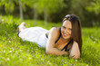 © zavgsg - Beautiful young woman relaxing in a park