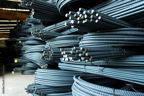 Fotografía Steel rods or bars used to reinforce concrete, in warehouse