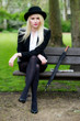 © Warren Millar - Beautiful young business woman sat on park bench