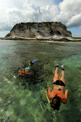 Wall Mural - Two people snorkeling on vacation