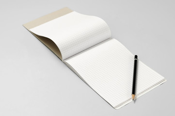 Blank notebook and pencil