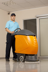 Wall Mural - cleaning floor with machine