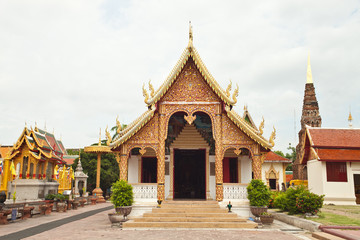 Wall Mural - Gold church  of prathat hariphunchai, lamphun , Thailand