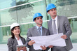 © goodluz - Business people checking construction site