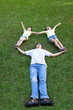 © Tom Wang - happy asian family lying and playing on the grass