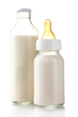Fototapete - bottles of milk isolated on white