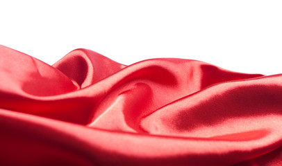 Red silk or satin fabric over white background