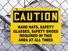 Caution Sign On Industrial Site