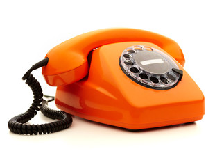 Vintage orange telephone over white background