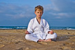 © photosiber - Karate boy meditates