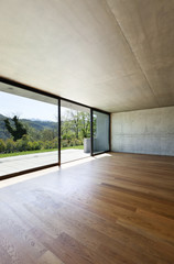 modern concrete house with hardwood floor, detail window