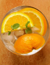 fresh orange  lemonade with mint leaves and ice