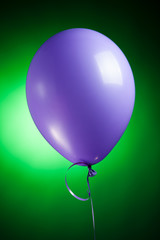 Wall Mural - festive purple balloon on green