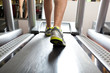Closeup of a man's legs training in a gym