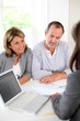 © goodluz - Senior couple ready to buy new house reading contract