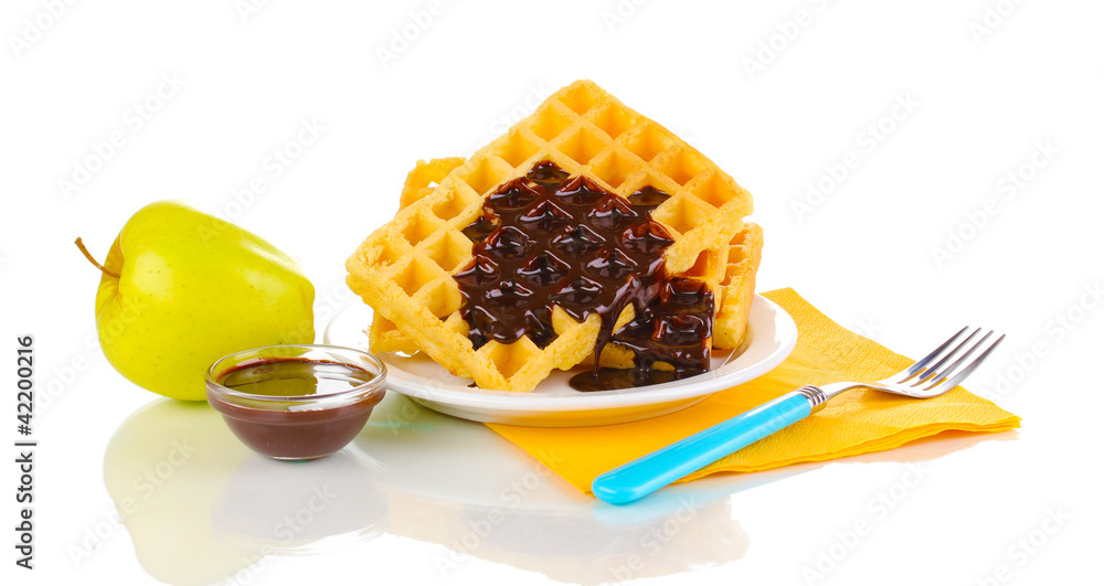 Tasty waffles with chocolate on plate isolated on white