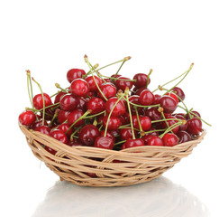 Fototapete - Ripe cherry berries in basket isolated on white