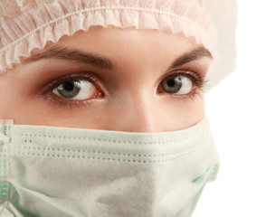 Female doctor wearing mask on white background