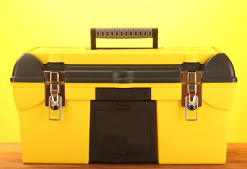 Wall Mural - yellow tool box isolated on white close-up