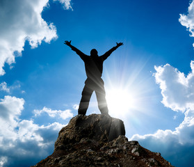 Canvas Print - Man on top of mountain.