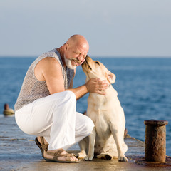 Middle-aged man with labrador dog