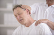 © mangostock - Chiropractic: Chiropractor doing neck adjustment