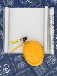 © Maksym Yemelyanov - Construction concept. Hardhat, blueprint and rulers.
