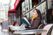 © Ekaterina Pokrovsky - Beautiful young woman with a book in cafe