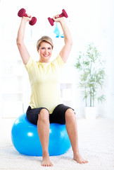 Canvas Print - Senior woman doing yoga.