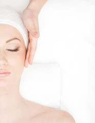 Portrait of a young woman laying on a spa procedure