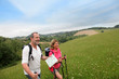 © goodluz - Senior couple hiking in natural landscape