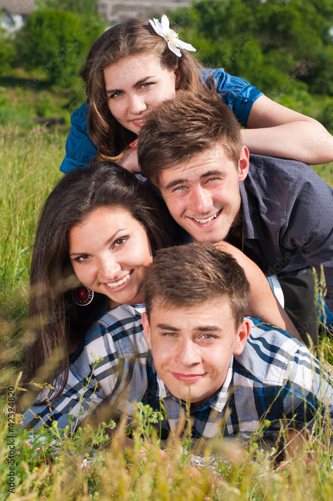happy young people two boys and two girls outdoors Stock Photo | Adobe Stock