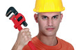 © auremar - Tradesman holding a pipe wrench