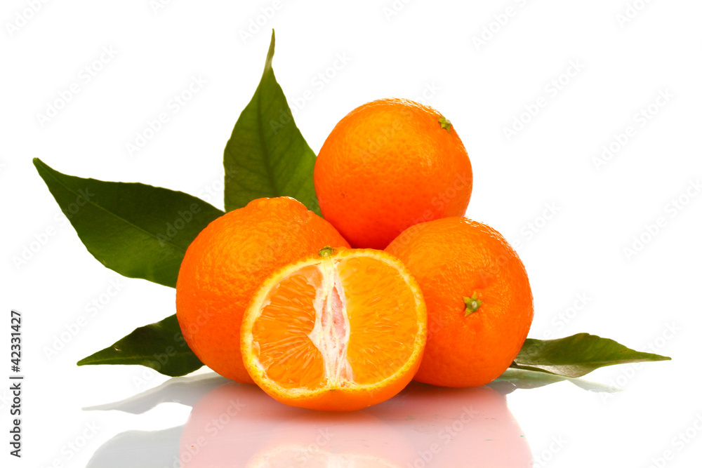 Ripe tasty tangerines with leaves and segments isolated on