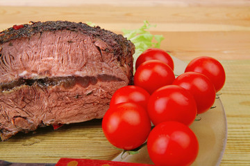 Wall Mural - beef on transparent plate over wood