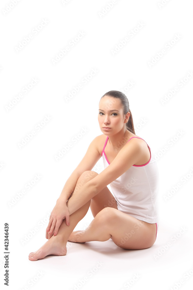 A woman sitting on a floor, isolated on white background - obrazy, fototapety, plakaty 