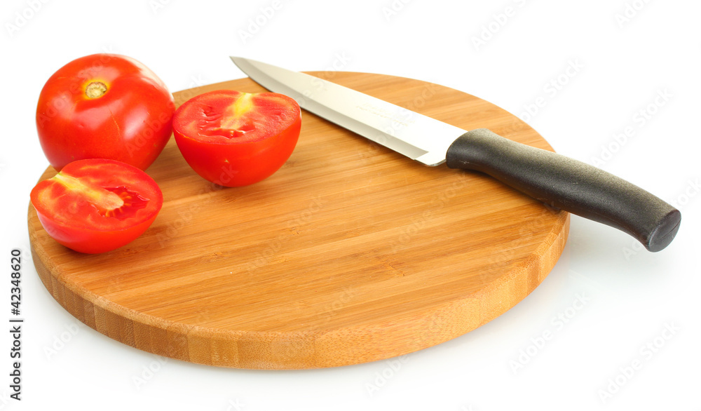 Ripe red tomatoes and knife on cutting board isolated on white