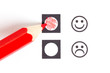 Red pencil choosing the right smiley